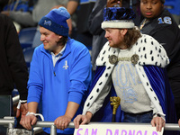 DETROIT,MICHIGAN-JANUARY 5: Fans in Lions spirit wear look on during a game between the Detroit Lions and the Minnesota Vikings in Detroit,...