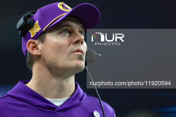 DETROIT,MICHIGAN-JANUARY 5:  Minnesota head coach Kevin O'Connell looks up to the screen during a game between the Detroit Lions and the Min...