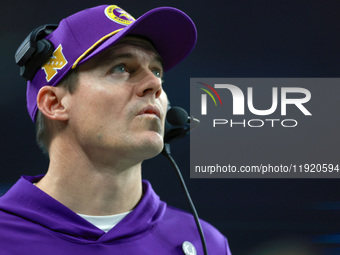 DETROIT,MICHIGAN-JANUARY 5:  Minnesota head coach Kevin O'Connell looks up to the screen during a game between the Detroit Lions and the Min...