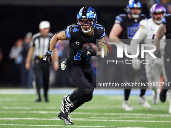 DETROIT,MICHIGAN-JANUARY 5:  Wide receiver Amon-Ra St. Brown (14) of the Detroit Lions carries the ball during a game between the Detroit Li...