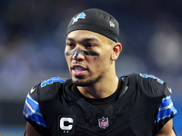 DETROIT,MICHIGAN-JANUARY 5:  Wide receiver Amon-Ra St. Brown (14) of the Detroit Lions walks off of the field at the conclusion of a game be...