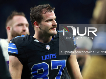 DETROIT,MICHIGAN-JANUARY 5:  Tight end Sam LaPorta (87) of the Detroit Lions walks off of the field at the conclusion of a game between the...