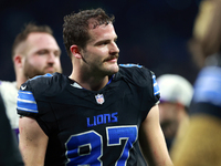 DETROIT,MICHIGAN-JANUARY 5:  Tight end Sam LaPorta (87) of the Detroit Lions walks off of the field at the conclusion of a game between the...