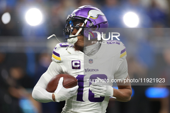 DETROIT,MICHIGAN-JANUARY 5:  Wide receiver Justin Jefferson (18) of the Minnesota Vikings receives the ball ahead of a game between the Detr...