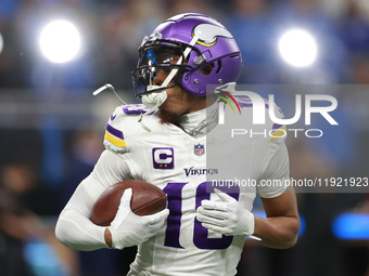 DETROIT,MICHIGAN-JANUARY 5:  Wide receiver Justin Jefferson (18) of the Minnesota Vikings receives the ball ahead of a game between the Detr...