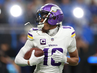 DETROIT,MICHIGAN-JANUARY 5:  Wide receiver Justin Jefferson (18) of the Minnesota Vikings receives the ball ahead of a game between the Detr...