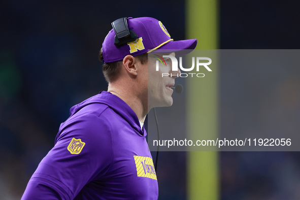 DETROIT,MICHIGAN-JANUARY 5:  Minnesota Vikings head coach Kevin O'Connell communicates during a game between the Detroit Lions and the Minne...