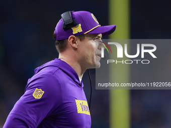 DETROIT,MICHIGAN-JANUARY 5:  Minnesota Vikings head coach Kevin O'Connell communicates during a game between the Detroit Lions and the Minne...