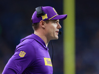 DETROIT,MICHIGAN-JANUARY 5:  Minnesota Vikings head coach Kevin O'Connell communicates during a game between the Detroit Lions and the Minne...