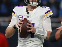 DETROIT,MICHIGAN-JANUARY 5:  Quarterback Sam Darnold (14) of the Minnesota Vikings looks to pass the ball during a game between the Detroit...