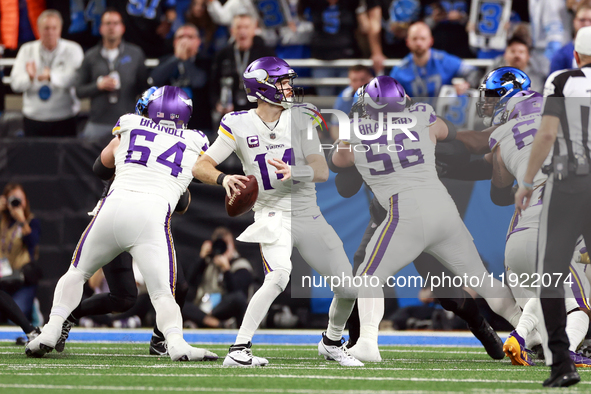 DETROIT,MICHIGAN-JANUARY 5:  Quarterback Sam Darnold (14) of the Minnesota Vikings looks to pass the ball during a game between the Detroit...