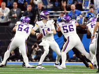 DETROIT,MICHIGAN-JANUARY 5:  Quarterback Sam Darnold (14) of the Minnesota Vikings looks to pass the ball during a game between the Detroit...