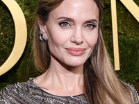 Angelina Jolie wearing McQueen arrives at the 82nd Annual Golden Globe Awards held at The Beverly Hilton Hotel on January 5, 2025 in Beverly...