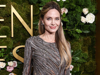 Angelina Jolie wearing McQueen arrives at the 82nd Annual Golden Globe Awards held at The Beverly Hilton Hotel on January 5, 2025 in Beverly...