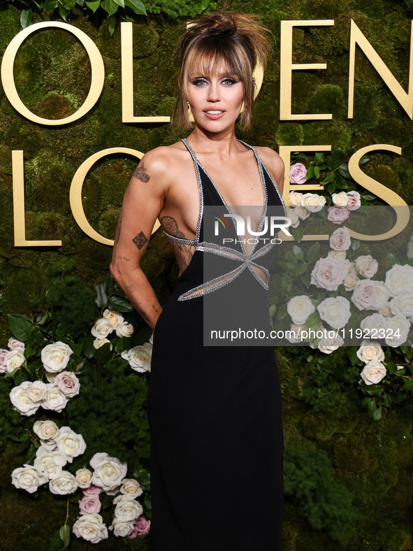 Miley Cyrus wearing Celine with Da Beers jewelry arrives at the 82nd Annual Golden Globe Awards held at The Beverly Hilton Hotel on January...