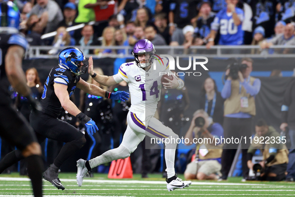 DETROIT,MICHIGAN-JANUARY 5:  Quarterback Sam Darnold (14) of the Minnesota Vikings runs the ball during a game between the Detroit Lions and...