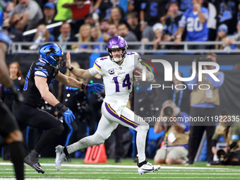 DETROIT,MICHIGAN-JANUARY 5:  Quarterback Sam Darnold (14) of the Minnesota Vikings runs the ball during a game between the Detroit Lions and...