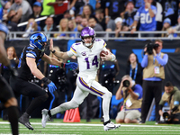 DETROIT,MICHIGAN-JANUARY 5:  Quarterback Sam Darnold (14) of the Minnesota Vikings runs the ball during a game between the Detroit Lions and...