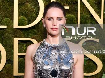 Felicity Jones wearing Prada with Chopard jewelry arrives at the 82nd Annual Golden Globe Awards held at The Beverly Hilton Hotel on January...