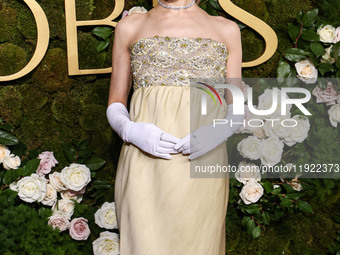 Ariana Grande Butera wearing archive Givenchy and Stuart Weitzman shoes arrives at the 82nd Annual Golden Globe Awards held at The Beverly H...