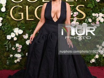 Ashley Graham wearing a custom Bach Mai dress, Gianvito Rossi shoes, and Jared jewelry arrives at the 82nd Annual Golden Globe Awards held a...