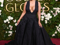 Ashley Graham wearing a custom Bach Mai dress, Gianvito Rossi shoes, and Jared jewelry arrives at the 82nd Annual Golden Globe Awards held a...