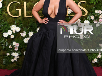 Ashley Graham wearing a custom Bach Mai dress, Gianvito Rossi shoes, and Jared jewelry arrives at the 82nd Annual Golden Globe Awards held a...