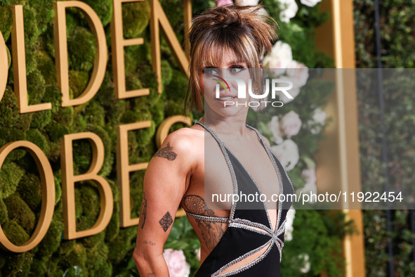 Miley Cyrus wearing Celine with Da Beers jewelry arrives at the 82nd Annual Golden Globe Awards held at The Beverly Hilton Hotel on January...