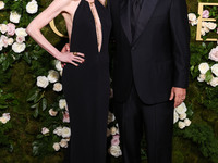 Jackie Sandler and husband Adam Sandler arrive at the 82nd Annual Golden Globe Awards held at The Beverly Hilton Hotel on January 5, 2025 in...