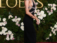 Miley Cyrus wearing Celine with Da Beers jewelry arrives at the 82nd Annual Golden Globe Awards held at The Beverly Hilton Hotel on January...