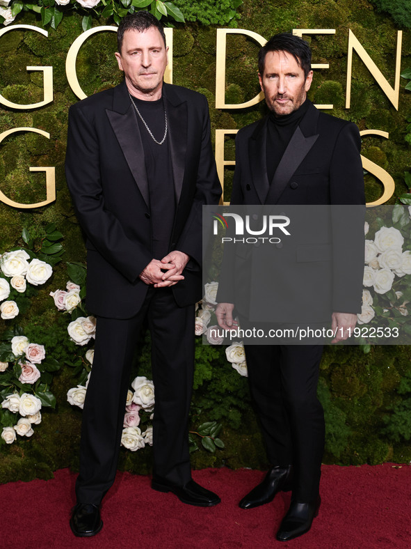 Atticus Ross and Trent Reznor arrive at the 82nd Annual Golden Globe Awards held at The Beverly Hilton Hotel on January 5, 2025 in Beverly H...