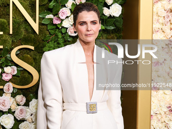 Keri Russell wearing a Stephane Rolland dress, Aquazzura shoes, a Tyler Ellis handbag, and Lagos jewelry arrives at the 82nd Annual Golden G...