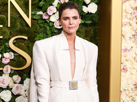 Keri Russell wearing a Stephane Rolland dress, Aquazzura shoes, a Tyler Ellis handbag, and Lagos jewelry arrives at the 82nd Annual Golden G...