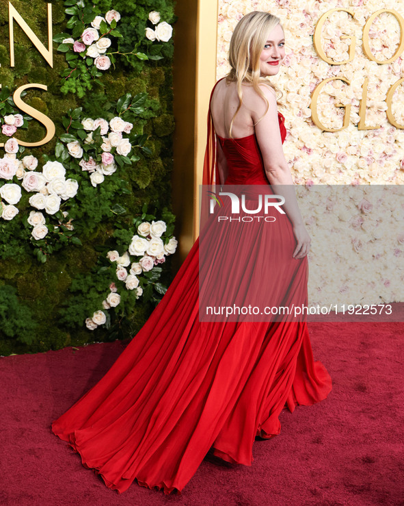 Dakota Fanning wearing custom Dolce and Gabanna arrives at the 82nd Annual Golden Globe Awards held at The Beverly Hilton Hotel on January 5...