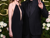 Jackie Sandler and husband Adam Sandler arrive at the 82nd Annual Golden Globe Awards held at The Beverly Hilton Hotel on January 5, 2025 in...