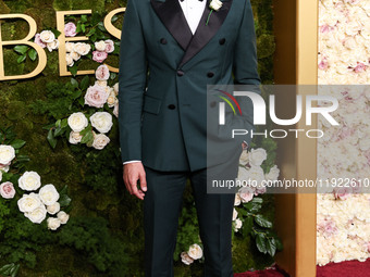 Adam Brody wearing Prada arrives at the 82nd Annual Golden Globe Awards held at The Beverly Hilton Hotel on January 5, 2025 in Beverly Hills...