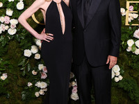 Jackie Sandler and husband Adam Sandler arrive at the 82nd Annual Golden Globe Awards held at The Beverly Hilton Hotel on January 5, 2025 in...