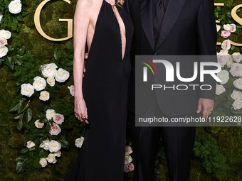 Jackie Sandler and husband Adam Sandler arrive at the 82nd Annual Golden Globe Awards held at The Beverly Hilton Hotel on January 5, 2025 in...