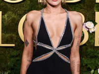 Miley Cyrus wearing Celine with Da Beers jewelry arrives at the 82nd Annual Golden Globe Awards held at The Beverly Hilton Hotel on January...