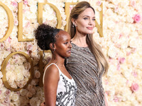 Zahara Marley Jolie and mother Angelina Jolie arrive at the 82nd Annual Golden Globe Awards held at The Beverly Hilton Hotel on January 5, 2...