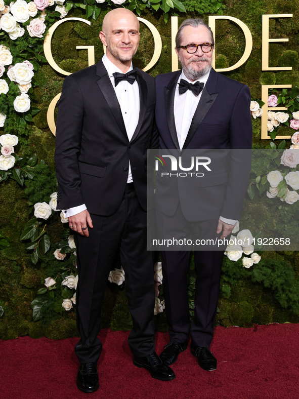 Adam Randall and Gary Oldman arrive at the 82nd Annual Golden Globe Awards held at The Beverly Hilton Hotel on January 5, 2025 in Beverly Hi...