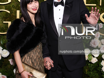 Riko Shibata and Nicolas Cage arrive at the 82nd Annual Golden Globe Awards held at The Beverly Hilton Hotel on January 5, 2025 in Beverly H...