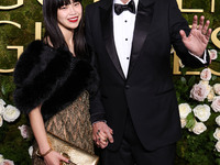 Riko Shibata and Nicolas Cage arrive at the 82nd Annual Golden Globe Awards held at The Beverly Hilton Hotel on January 5, 2025 in Beverly H...