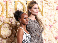 Zahara Marley Jolie and mother Angelina Jolie arrive at the 82nd Annual Golden Globe Awards held at The Beverly Hilton Hotel on January 5, 2...