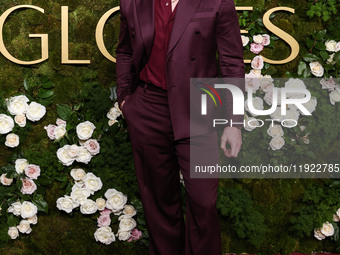 Nicholas Alexander Chavez wearing Versace with Christian Louboutin boots arrives at the 82nd Annual Golden Globe Awards held at The Beverly...