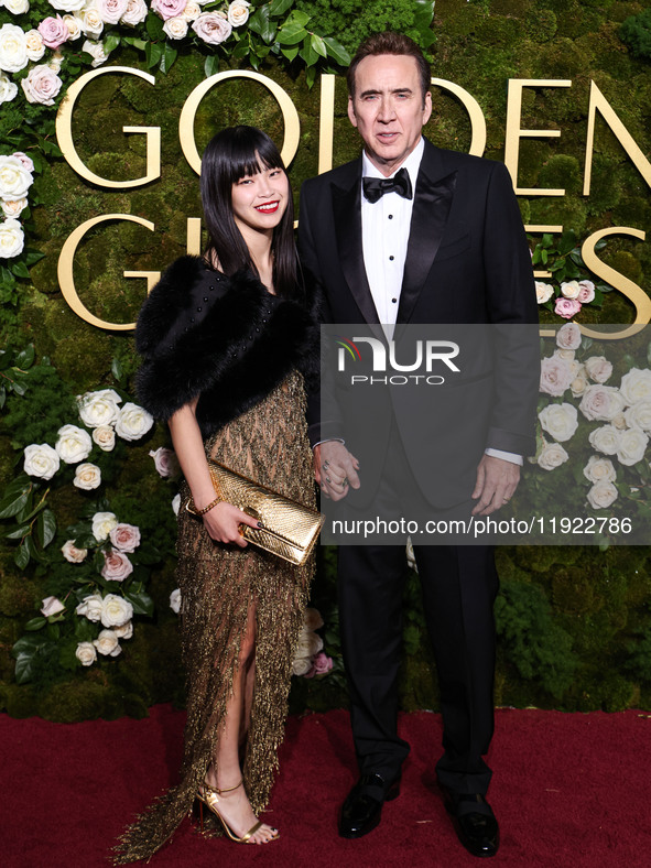 Riko Shibata and Nicolas Cage arrive at the 82nd Annual Golden Globe Awards held at The Beverly Hilton Hotel on January 5, 2025 in Beverly H...