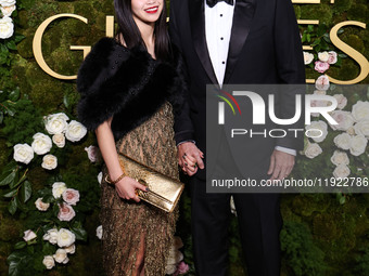 Riko Shibata and Nicolas Cage arrive at the 82nd Annual Golden Globe Awards held at The Beverly Hilton Hotel on January 5, 2025 in Beverly H...