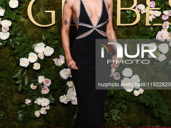 Miley Cyrus wearing Celine with Da Beers jewelry arrives at the 82nd Annual Golden Globe Awards held at The Beverly Hilton Hotel on January...