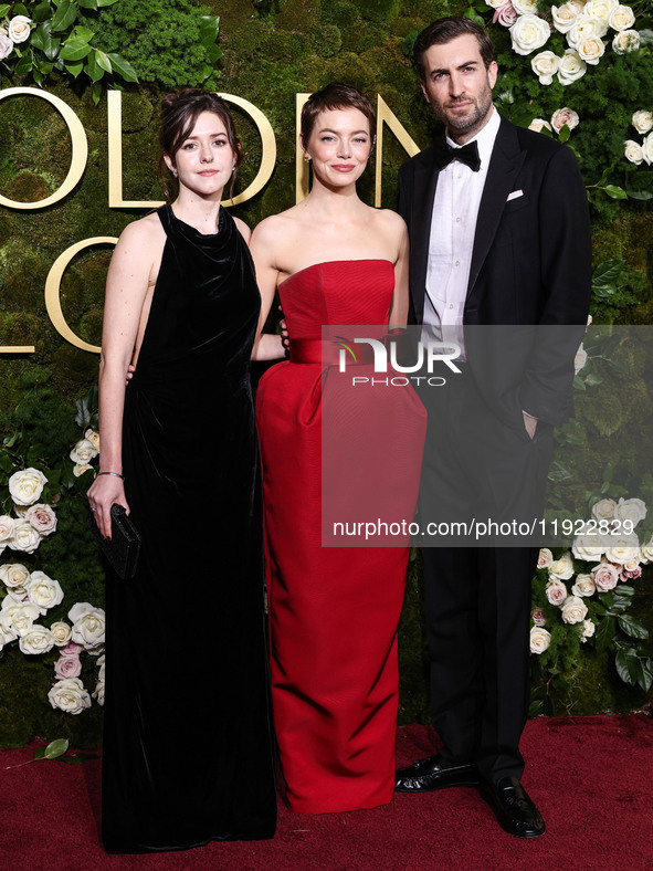 Ali Hertig, Emma Stone and Dave McCary arrive at the 82nd Annual Golden Globe Awards held at The Beverly Hilton Hotel on January 5, 2025 in...