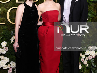 Ali Hertig, Emma Stone and Dave McCary arrive at the 82nd Annual Golden Globe Awards held at The Beverly Hilton Hotel on January 5, 2025 in...